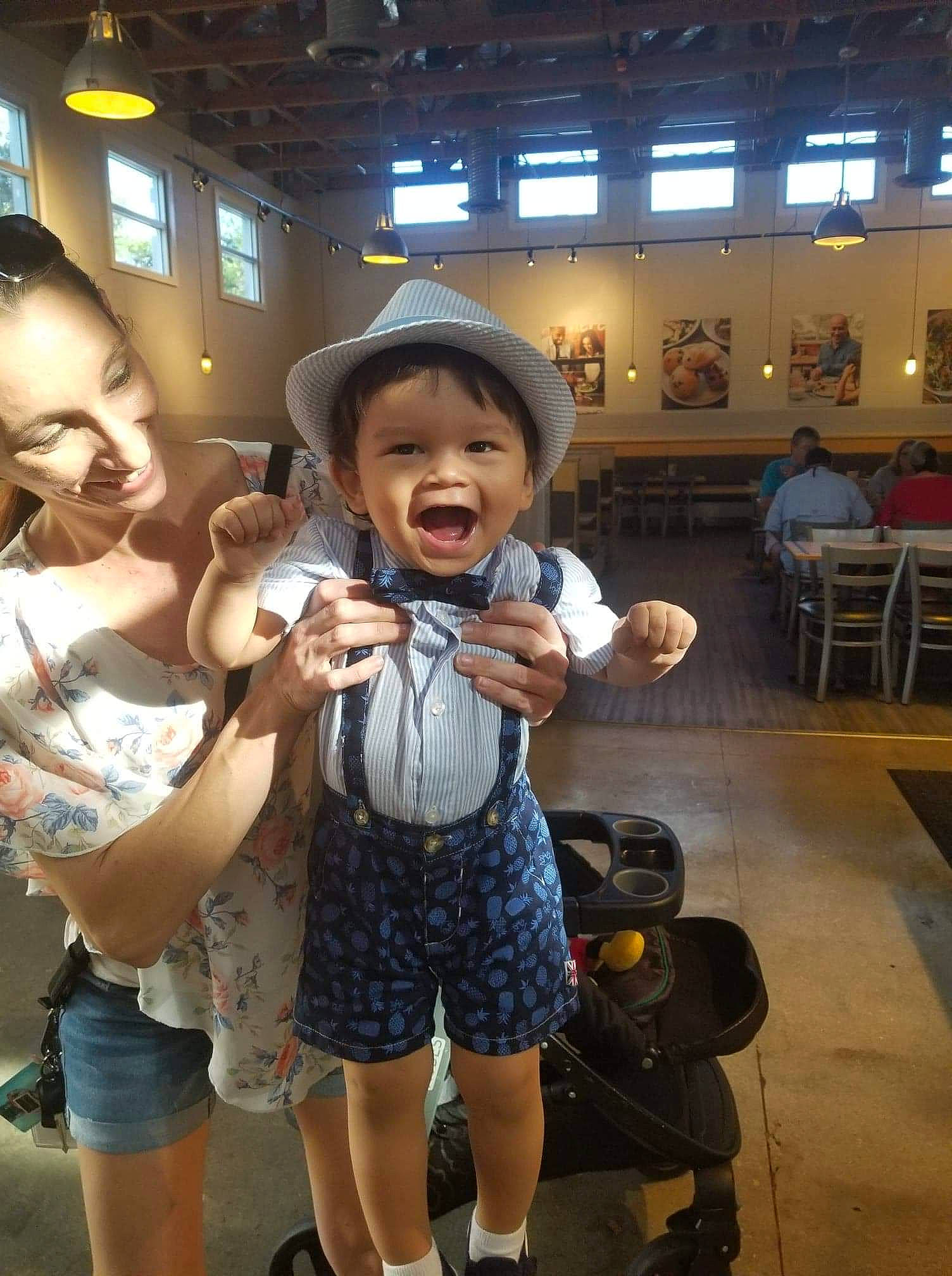 Nathanial is registered to the contest to win money with this photo: child, person, snapshot, under_exposed