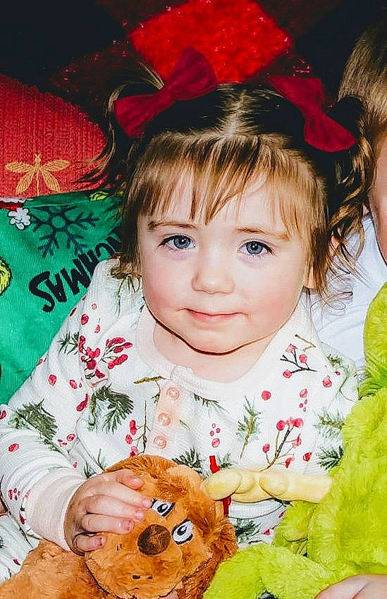 Mckenzie is registered to the contest to win money with this photo: baby, baby_toddler_clothing, cheek, child, child_model, costume_accessory, dog_breed, fawn, fur, hair_accessory, headband, headgear, headpiece, human, iris, joy, natural_material, person, sporting_group, stuffed_toy