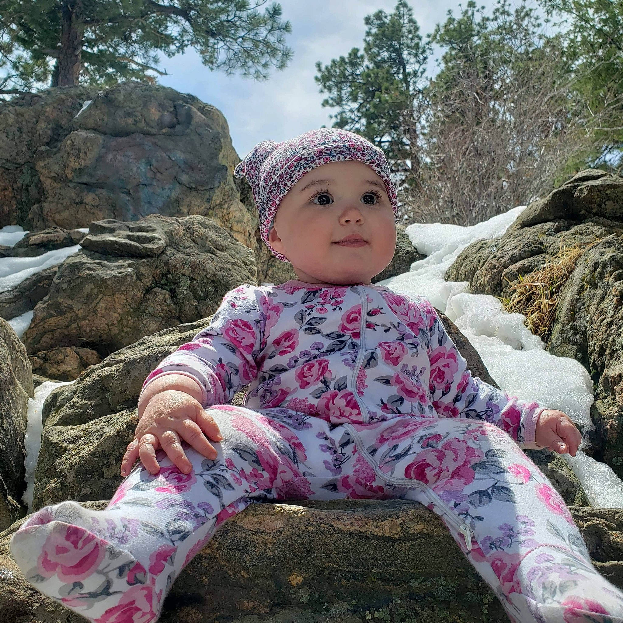 Denver joined the competition — help win amazing prizes! baby_toddler_clothing, cap, child, cool, facial_expression, freezing, fun, grass, happy, headwear, knit_cap, leisure, people_in_nature, person, plant, sitting, sky, sleeve, toddler, tree