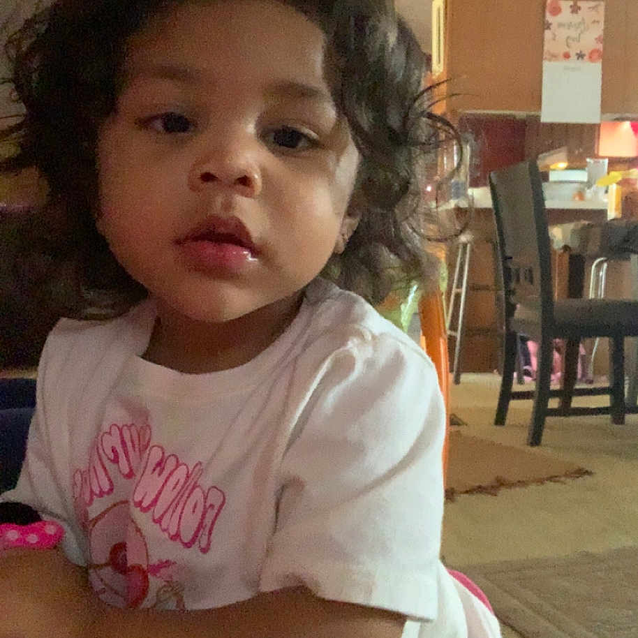 Kamia is registered to the contest to win money with this photo: architecture, building, child, clothing, diningroom, diningtable, face, female, furniture, girl, head, indoors, person, photography, portrait, restaurant, room, sitting, t_shirt, table