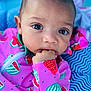 Isla joined the competition — help win amazing prizes! baby, infant, child, face, hand, clothing, watermelon_pattern, pink, blue, blanket, closeup, cute, portrait, skin, eyes, sleeve, fabric, pattern, indoor, young