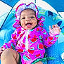 baby, child, smile, happy, swimsuit, bonnet, watermelon_pattern, tent, blue, fabric, infant, playtime, cute, summer, outdoor_gear, colorful, clothing, cheerful, portrait, person