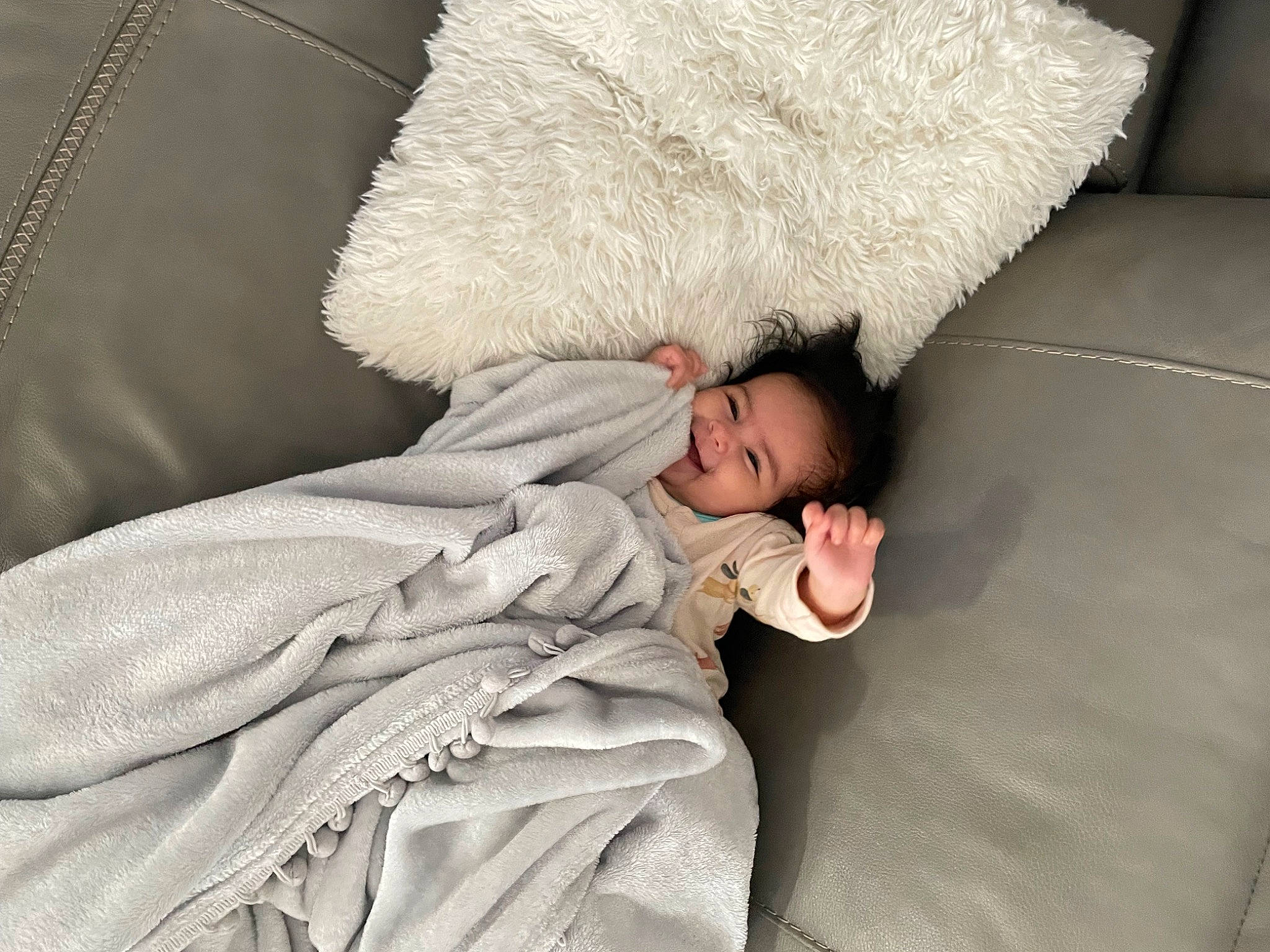 Arlet is registered to the contest to win money with this photo: arm, baby, bed, bedding, child, comfort, couch, eye, face, flooring, fur, hand, human_body, human_leg, linens, person, sitting, toddler, tree, wood