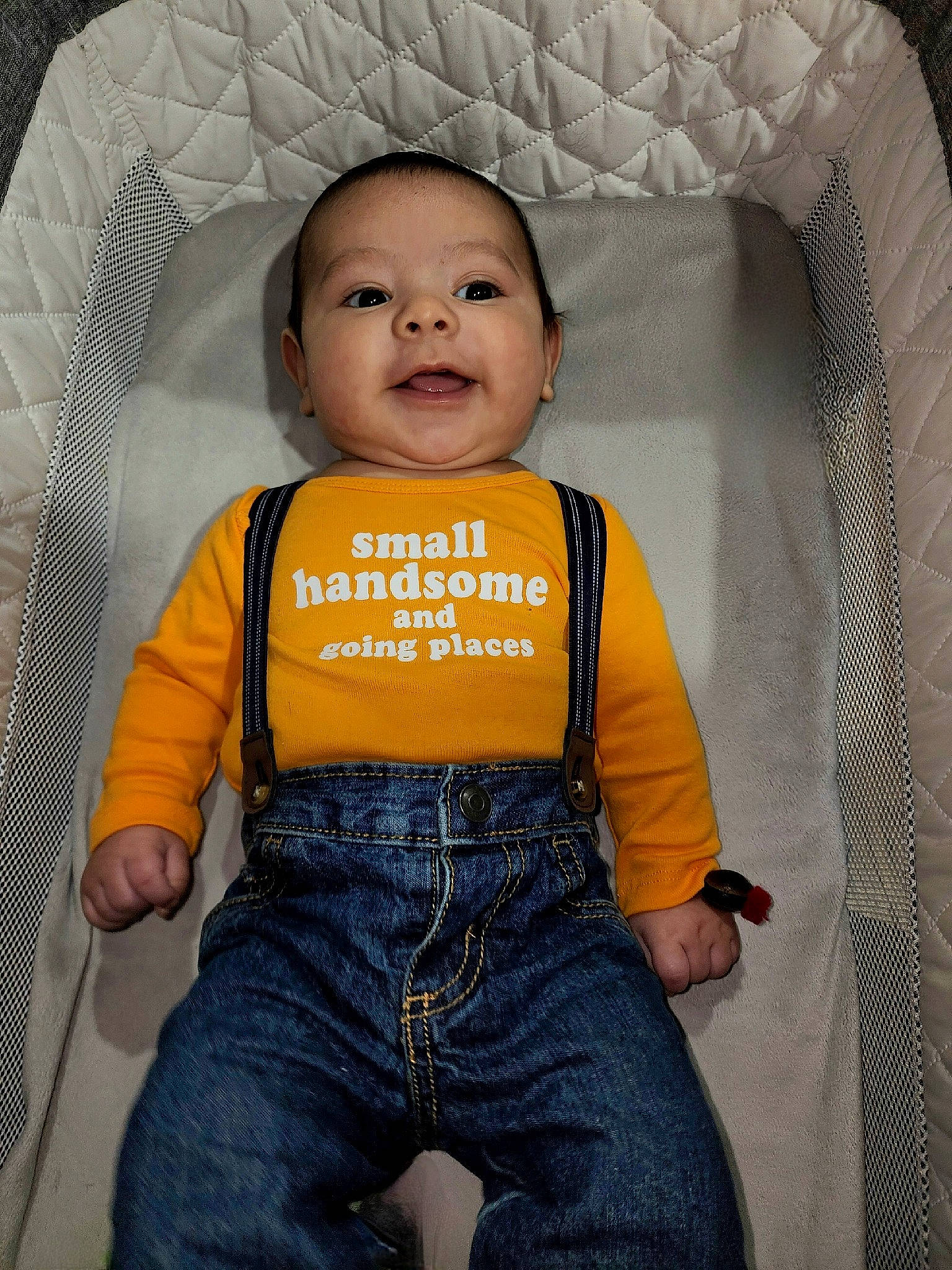 Ace joined the competition — help win amazing prizes! baby, baby_products, baby_toddler_clothing, cheek, child, clothing, comfort, eye, head, human_body, nose, orange, person, product, sitting, skin, sleeve, smile, t_shirt, textile