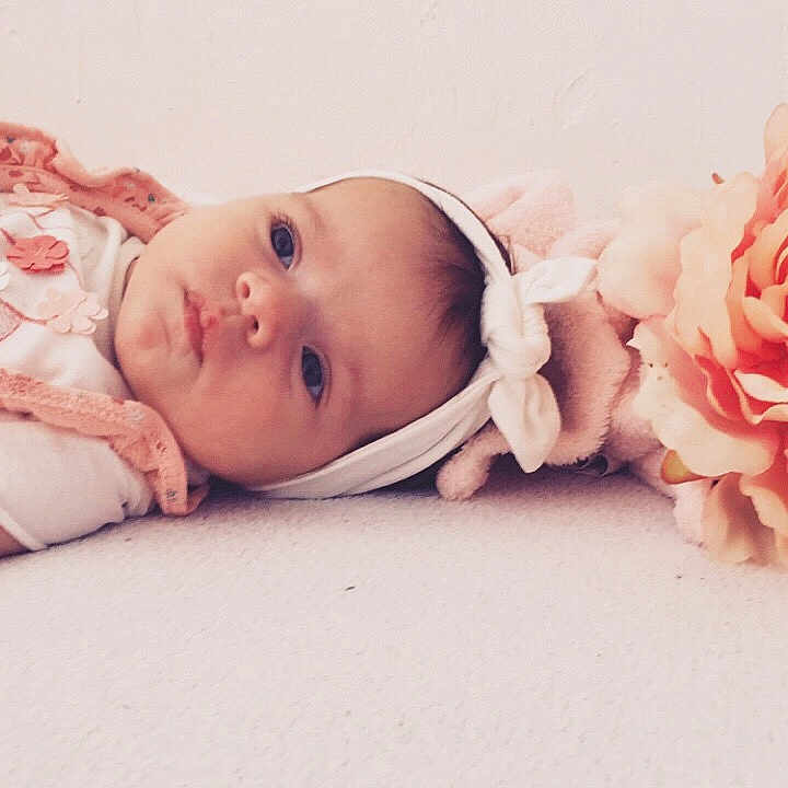 Kamylia participe au concours pour gagner de l'argent avec cette photo : baby, baby_sleeping, baby_toddler_clothing, cheek, child, fashion_accessory, flower, hair_accessory, hand, headband, headgear, headpiece, photograph, photography, pink, plant, portrait_photography, product, skin, toddler