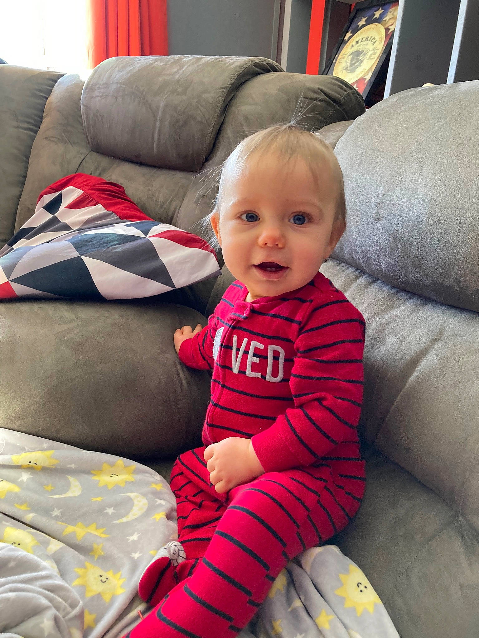 Joel joined the competition — help win amazing prizes! auto_part, baby, baby_toddler_clothing, car_seat, child, comfort, couch, fun, furniture, lap, living_room, magenta, person, product, room, sitting, sleeve, smile, textile, throw_pillow
