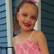 Gianna is registered to the contest to win money with this photo: child, girl, pink_dress, hair_bow, smiling, makeup, curly_hair, outdoor, house_siding, railing, portrait, happy, posing, tutu, earrings, fashion, childhood, cute, celebration, young_girl