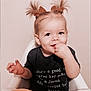 arm, baby, biting, bodypart, clothing, eating, face, finger, food, hair, hand, happy, head, person, photography, portrait, sitting, smile, t_shirt, wrist