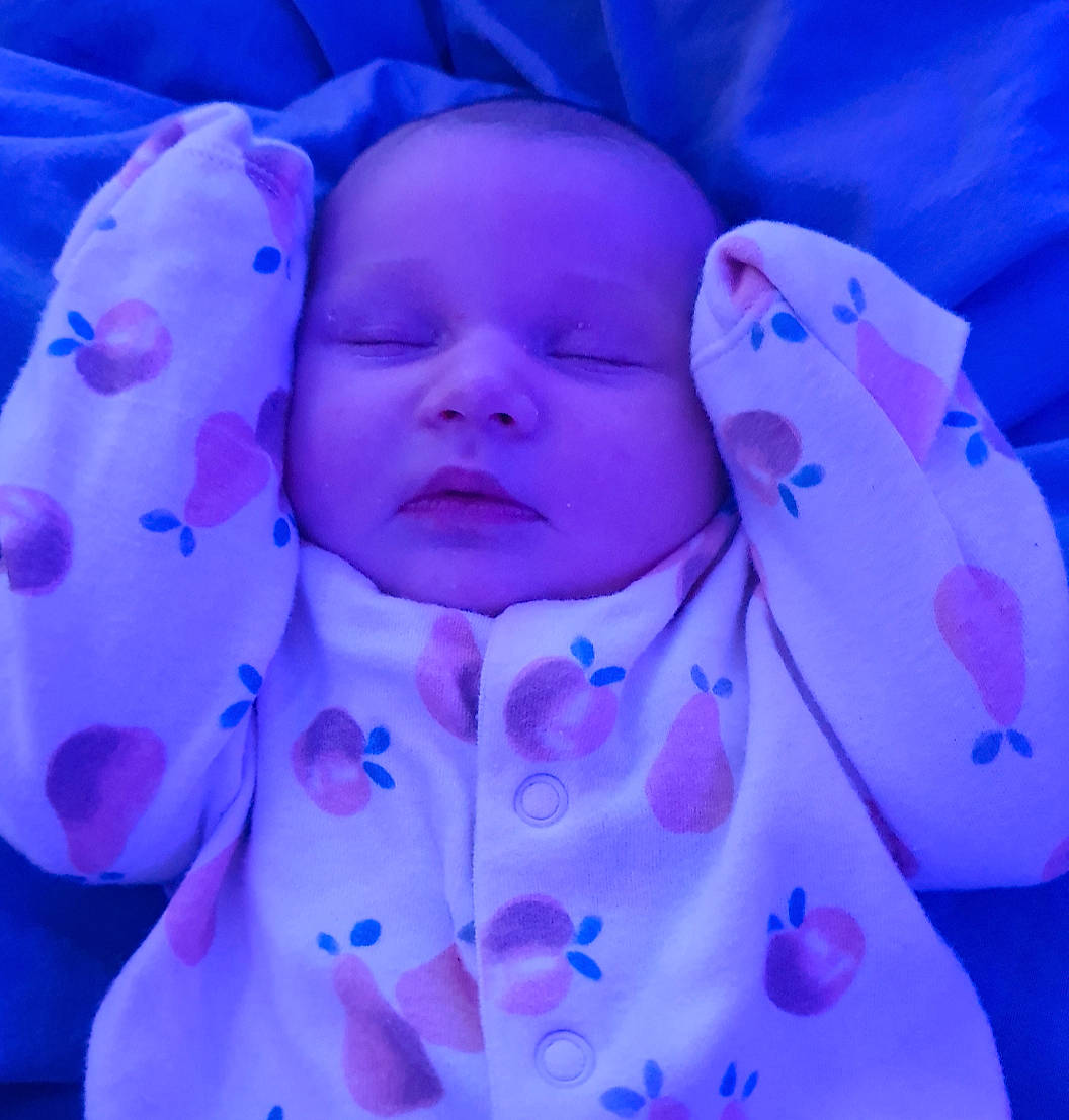 Lexi is registered to the contest to win money with this photo: baby, baby_toddler_clothing, cheek, child, circle, close_up, comfort, electric_blue, flower, happy, linens, magenta, pattern, person, petal, pink, purple, symmetry, toddler, violet