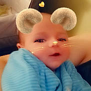 Noe a rejoint le concours — aidez-le/la à gagner de superbes lots ! baby, child, face, blue_blanket, mouse_ears_filter, whiskers, hearts, cute, infant, smiling, closeup, indoors, person, portrait, soft_lighting, young_child, wrapped, cozy, digital_filter, adorable