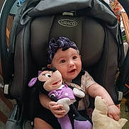 Cheyanne joined the competition — help win amazing prizes! baby, baby_girl, car_seat, car_seat_harness, child, clothing, cute, face, graco, happy, headband, indoor, infant, person, plush_toy, seatbelt, sitting, smiling, stuffed_animal, toy