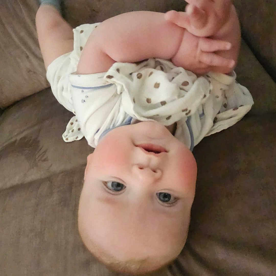 Oliver is registered to the contest to win money with this photo: accessories, baby, bed, bodypart, couch, cushion, face, finger, furniture, hand, head, homedecor, jewelry, newborn, person, photography, portrait, quilt, ring, sleeping