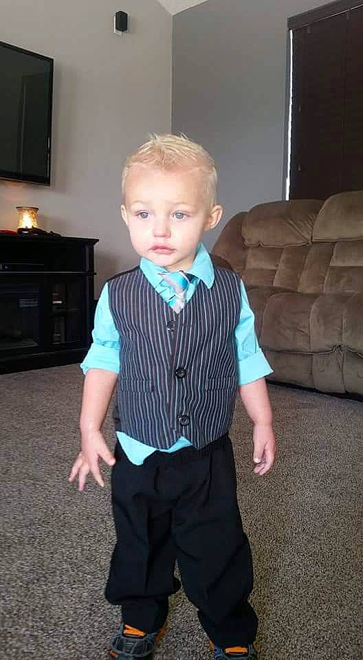 J.j. is registered to the contest to win money with this photo: baby_toddler_clothing, child, formal_wear, male, outerwear, person, sleeve, standing, suit, tie, toddler, turquoise, tuxedo