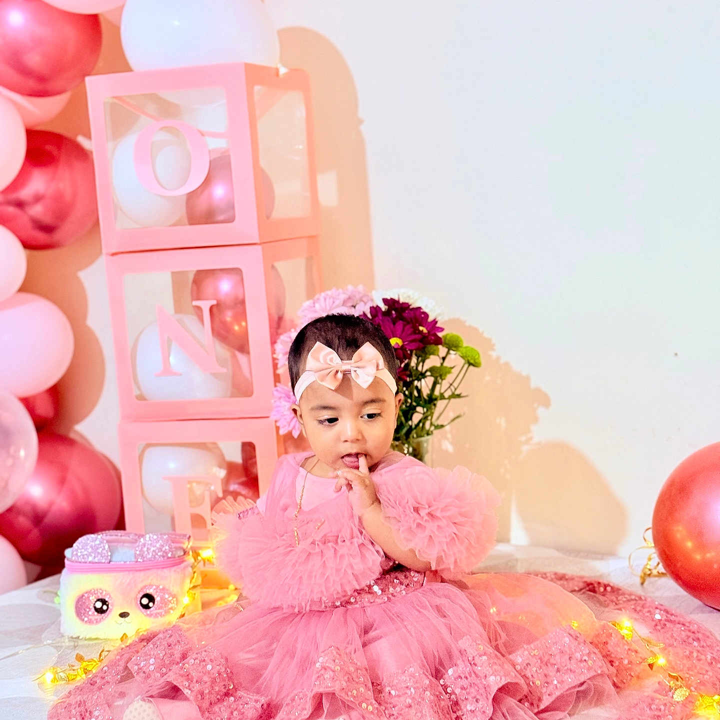 Arafah joined the competition — help win amazing prizes! adorable, baby, balloons, birthday, celebration, child, cute, decorations, fairy_lights, festive, flowers, happy, headband, indoor, pink_dress, plush_purse, portrait, ruffles, seated, tulle