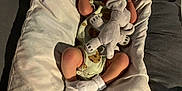Oliver joined the competition — help win amazing prizes! newborn, baby, infant, pillow, blanket, hat, pacifier, plush_toy, elephant_toy, socks, sleeping, bed, indoor, soft, cute, resting, child, person, cozy, comfort