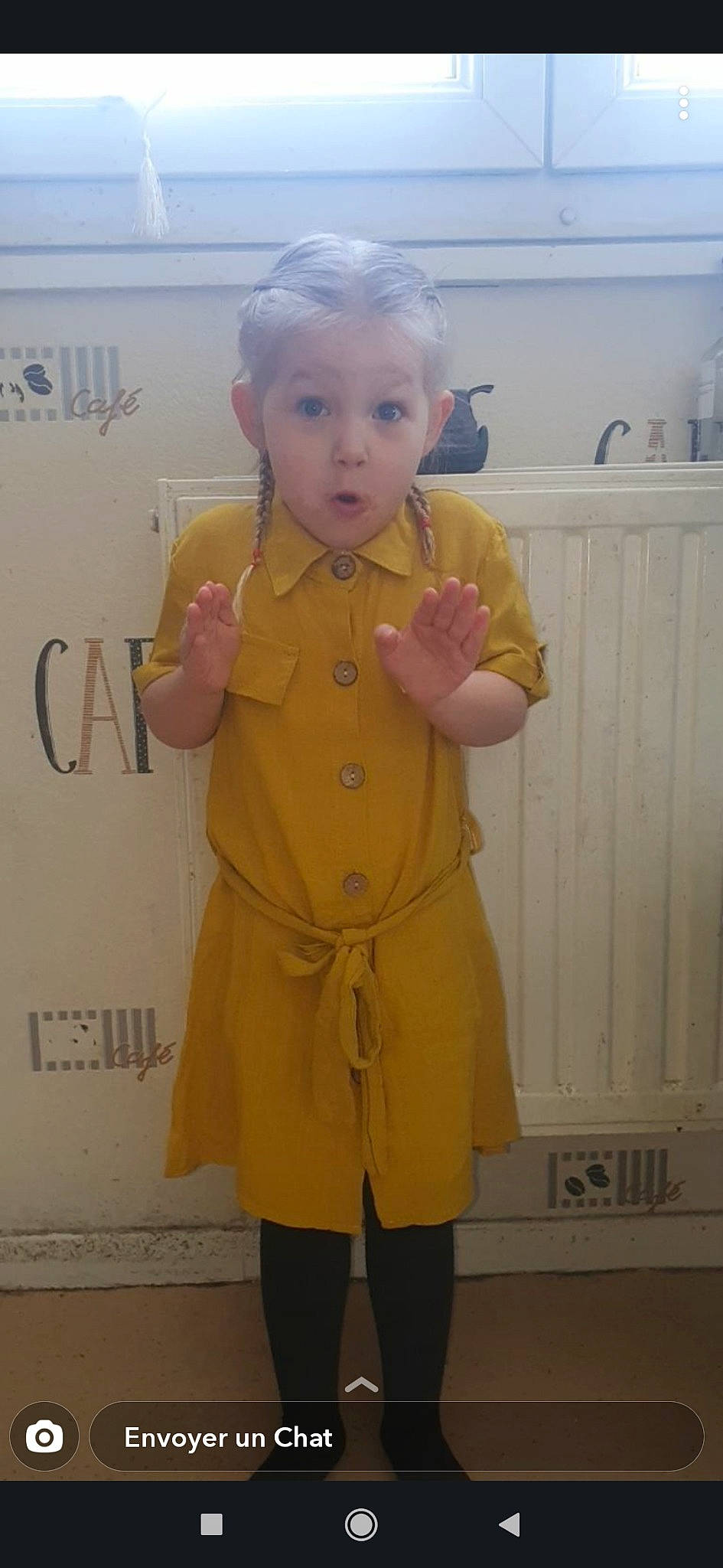 Kelya participe au concours pour gagner de l'argent avec cette photo : child, clothing, outerwear, person, raincoat, standing, surprise, toddler, yellow