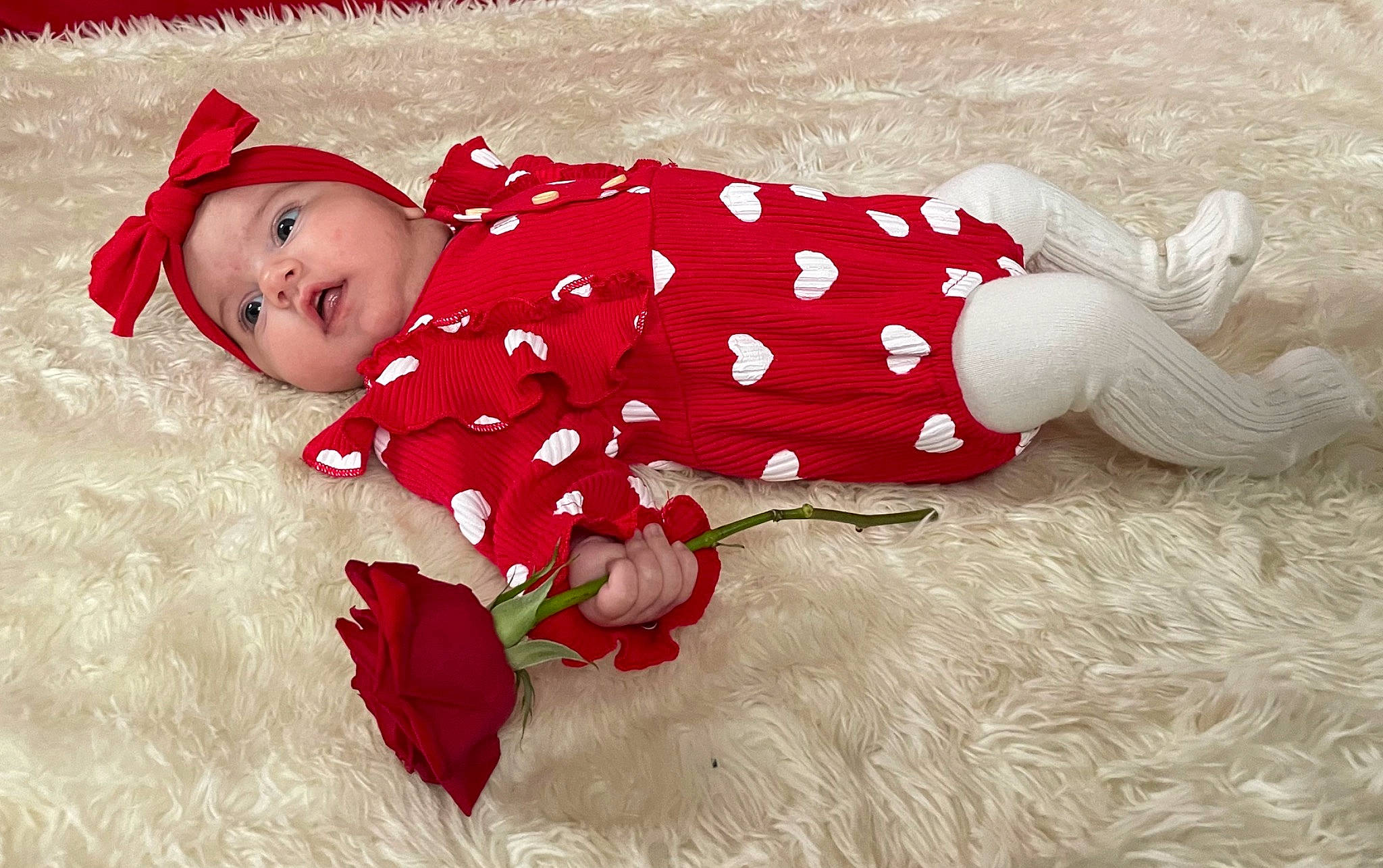 Laurel joined the competition — help win amazing prizes! baby, baby_products, baby_toddler_clothing, carmine, child, costume_hat, fun, grass, happy, hat, headwear, human_leg, magenta, pattern, people_in_nature, person, petal, skin, sleeve, smile