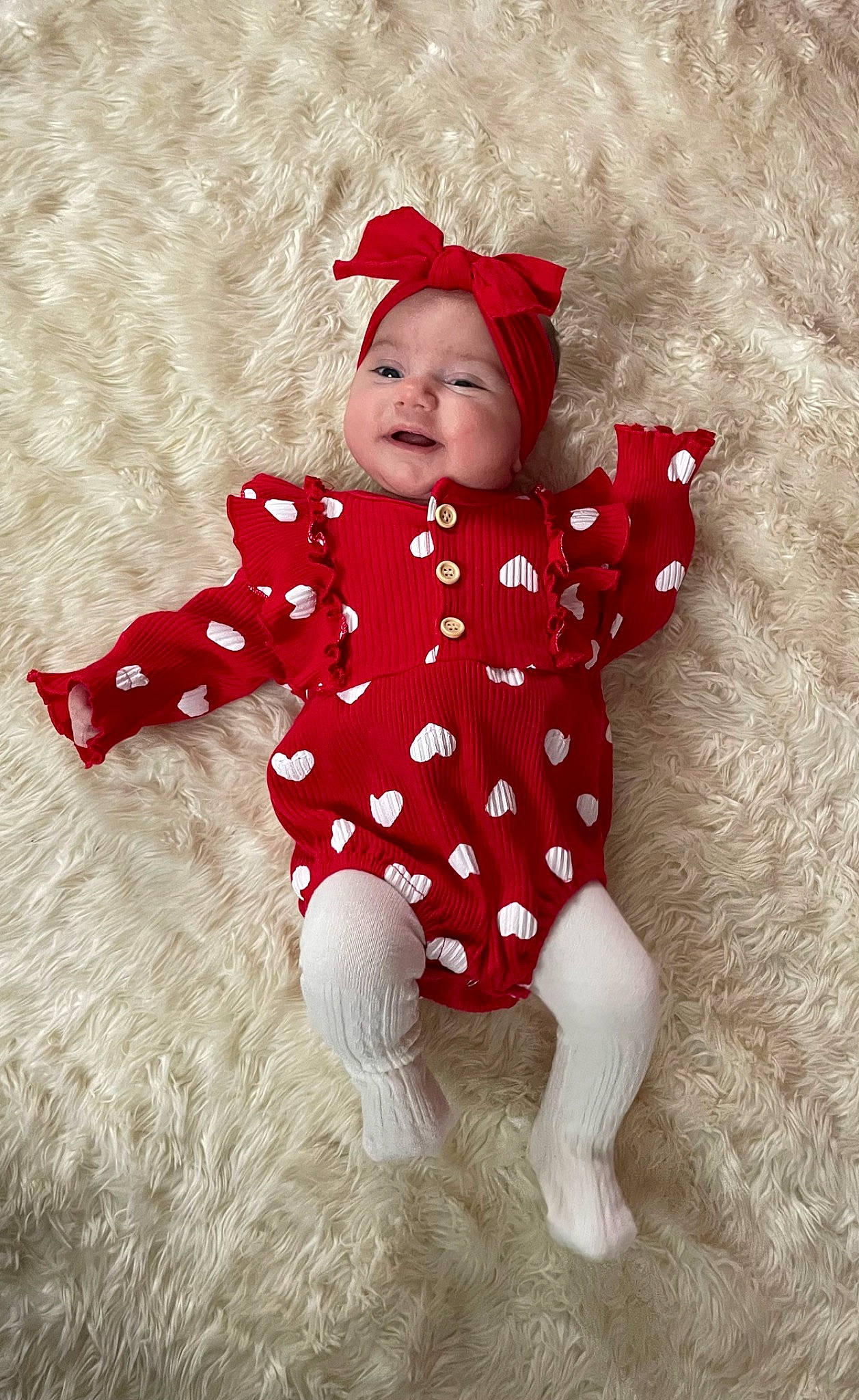 Laurel joined the competition — help win amazing prizes! baby, baby_toddler_clothing, carmine, child, costume_accessory, costume_hat, face, happy, headwear, magenta, pattern, person, sitting, sleeve, smile, textile, toddler