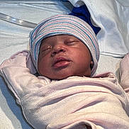 Azalea is registered to the contest to win money with this photo: newborn, baby, sleeping, infant, hospital, blanket, hat, clothing, bed, medical, peaceful, cute, closeup, portrait, person, resting, skin, face, child, soft