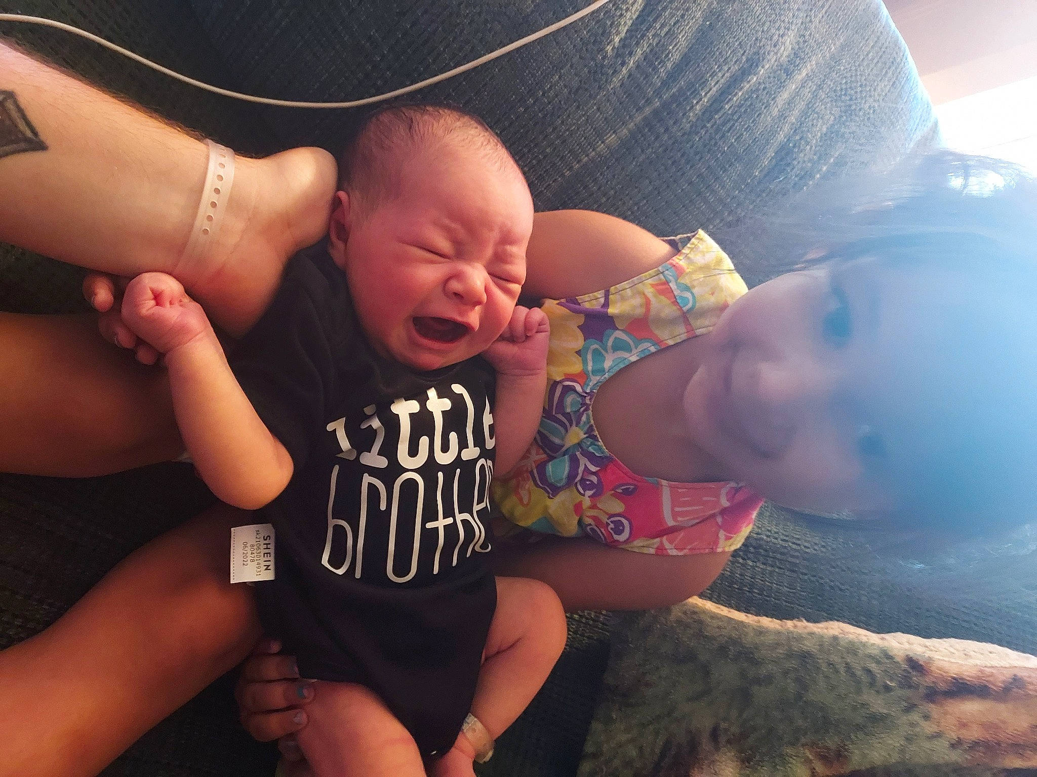 Zariyah is registered to the contest to win money with this photo: arm, baby, blurred, cloud, comfort, eye, facial_expression, flash_photography, glasses, hairstyle, hand, head, human, joint, joy, leg, mouth, muscle, neck, person