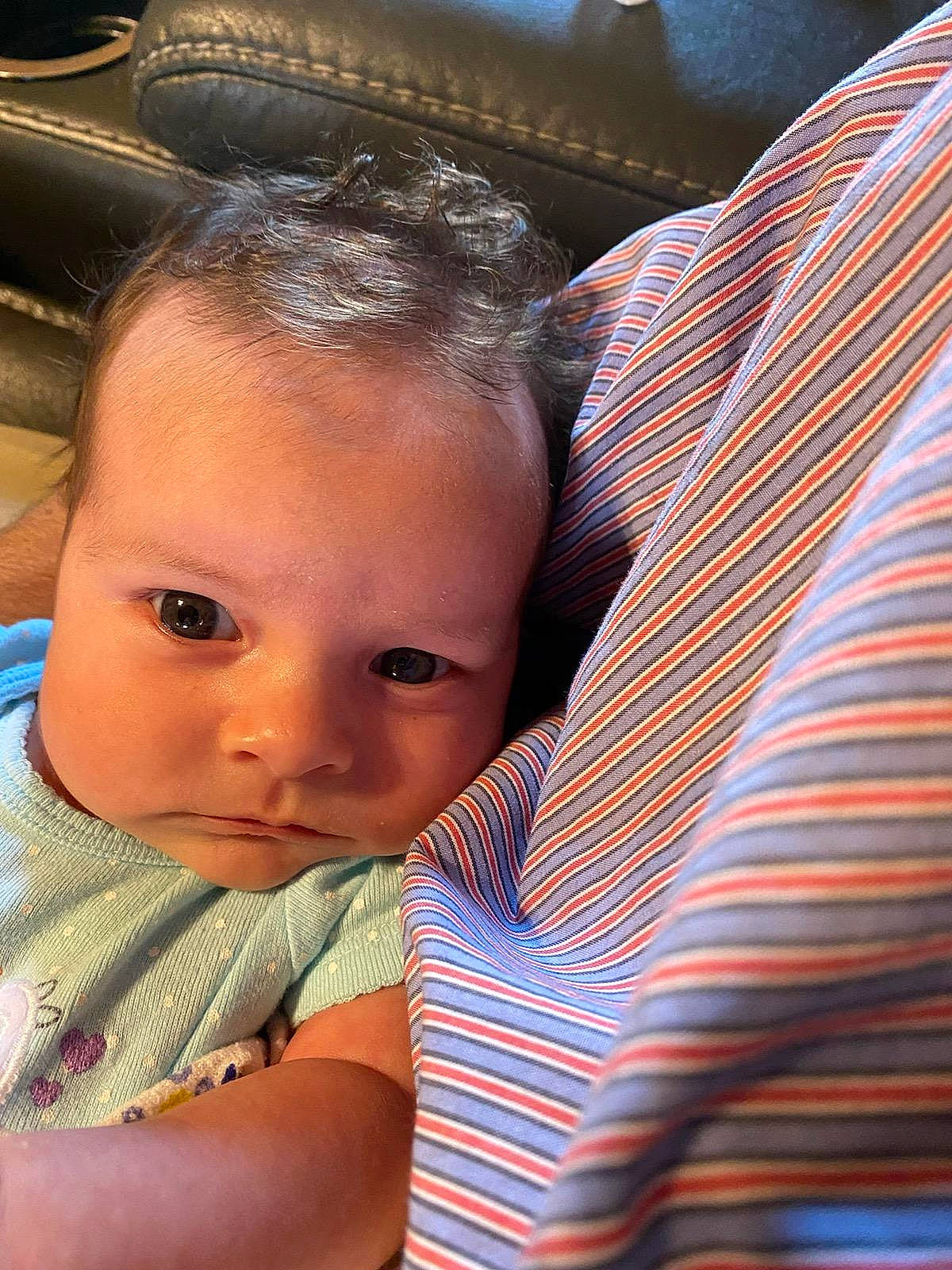 Ruby is registered to the contest to win money with this photo: baby, baby_toddler_clothing, black_hair, cheek, child, chin, comfort, eyebrow, eyelash, forehead, fun, hairstyle, happy, iris, lip, mouth, nose, person, sitting, skin