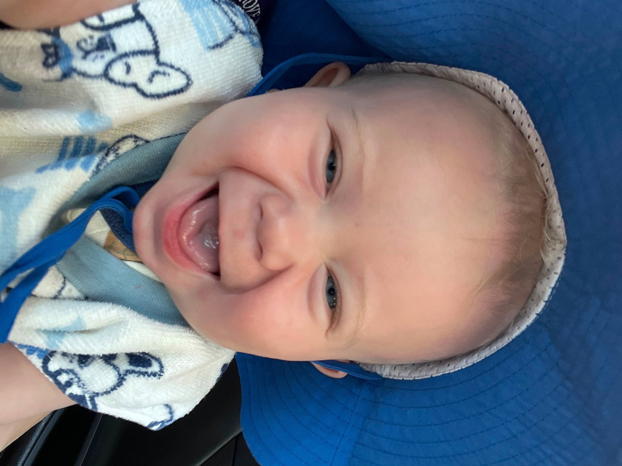 Evander joined the competition — help win amazing prizes! baby, baby_toddler_clothing, blue, cheek, chin, clothing, eye, eyebrow, face, forehead, happy, head, headgear, iris, lip, mouth, nose, person, skin, smile