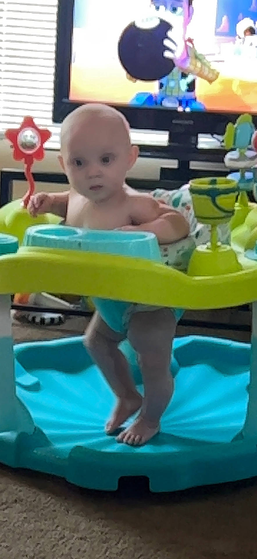Clark is registered to the contest to win money with this photo: baby, baby_products, baby_toddler_clothing, barefoot, blue, chair, child, fun, happy, leisure, person, plastic, play, product, recreation, shorts, sitting, snapshot, toddler, vacation