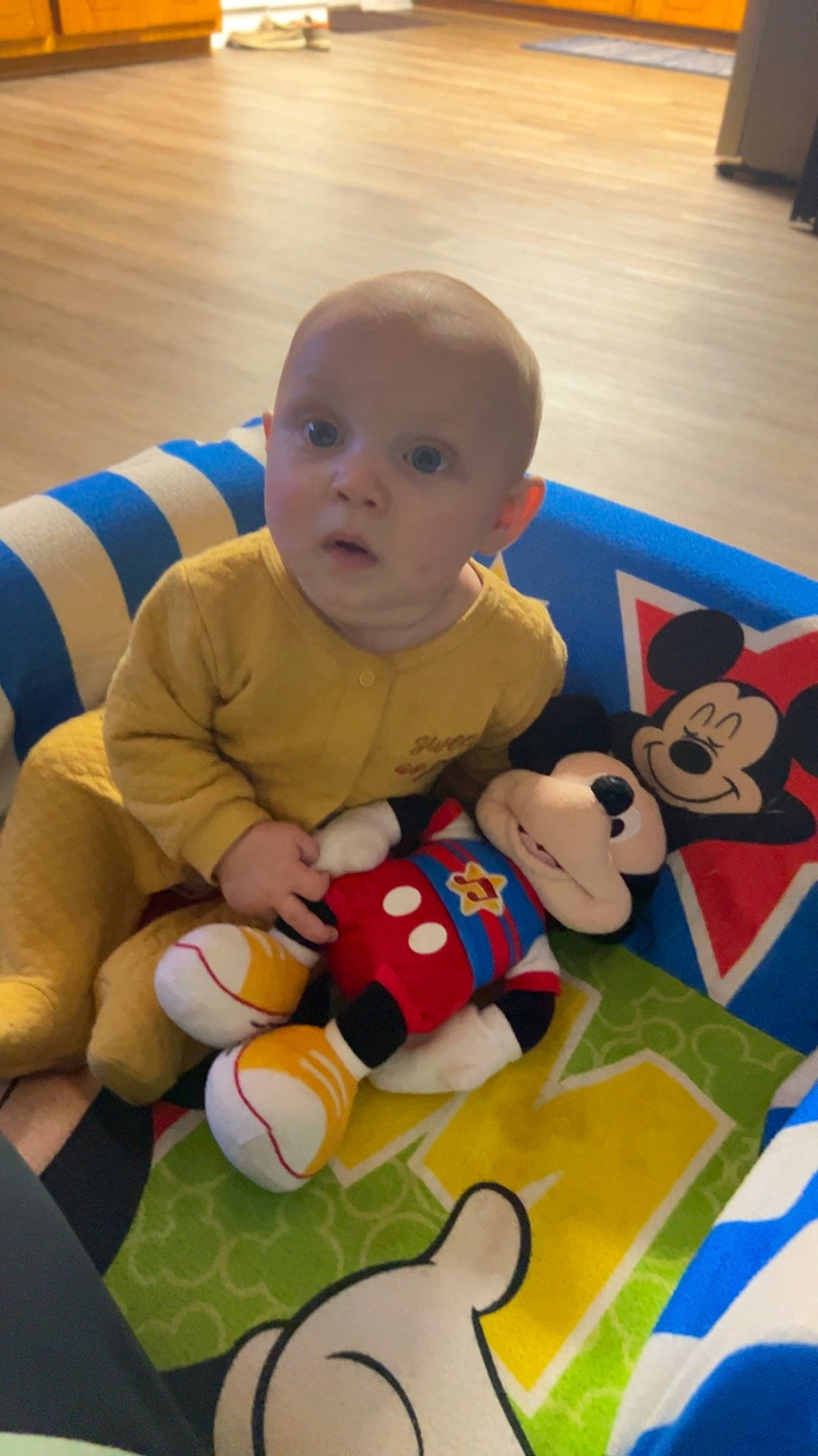 Clark is registered to the contest to win money with this photo: baby, baby_products, baby_toys, carmine, cheek, child, comfort, facial_expression, flooring, fun, happy, head, person, plush, room, sitting, stuffed_toy, surprise, textile, toddler
