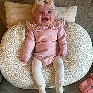 Nevah joined the competition — help win amazing prizes! apparel, baby, bow, child, cozy, cushion, cute, happy, headband, indoor, infant, knitted, patterned_cushion, pink_clothing, portrait, seated, smiling, sofa, tights, young_child