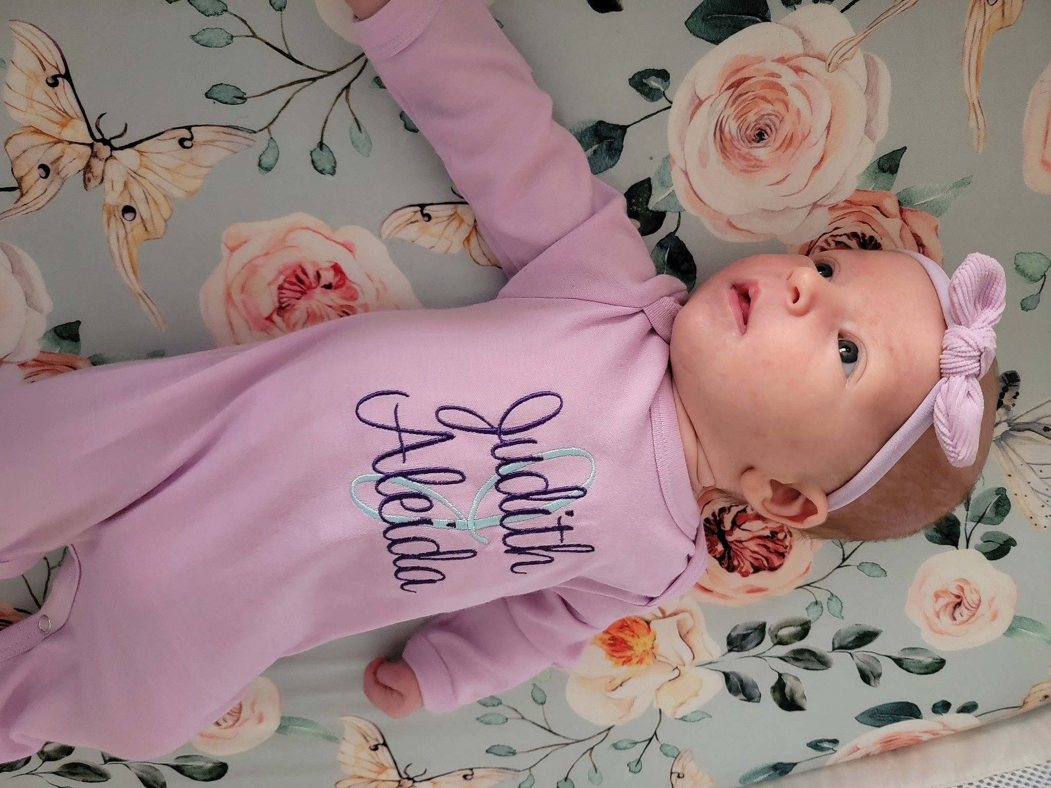 Judy is registered to the contest to win money with this photo: arm, baby_products, cheek, child, doll, eyelash, hand, happy, head, headwear, pattern, peach, person, pink, product, room, skin, sleeve, sweetness, toddler