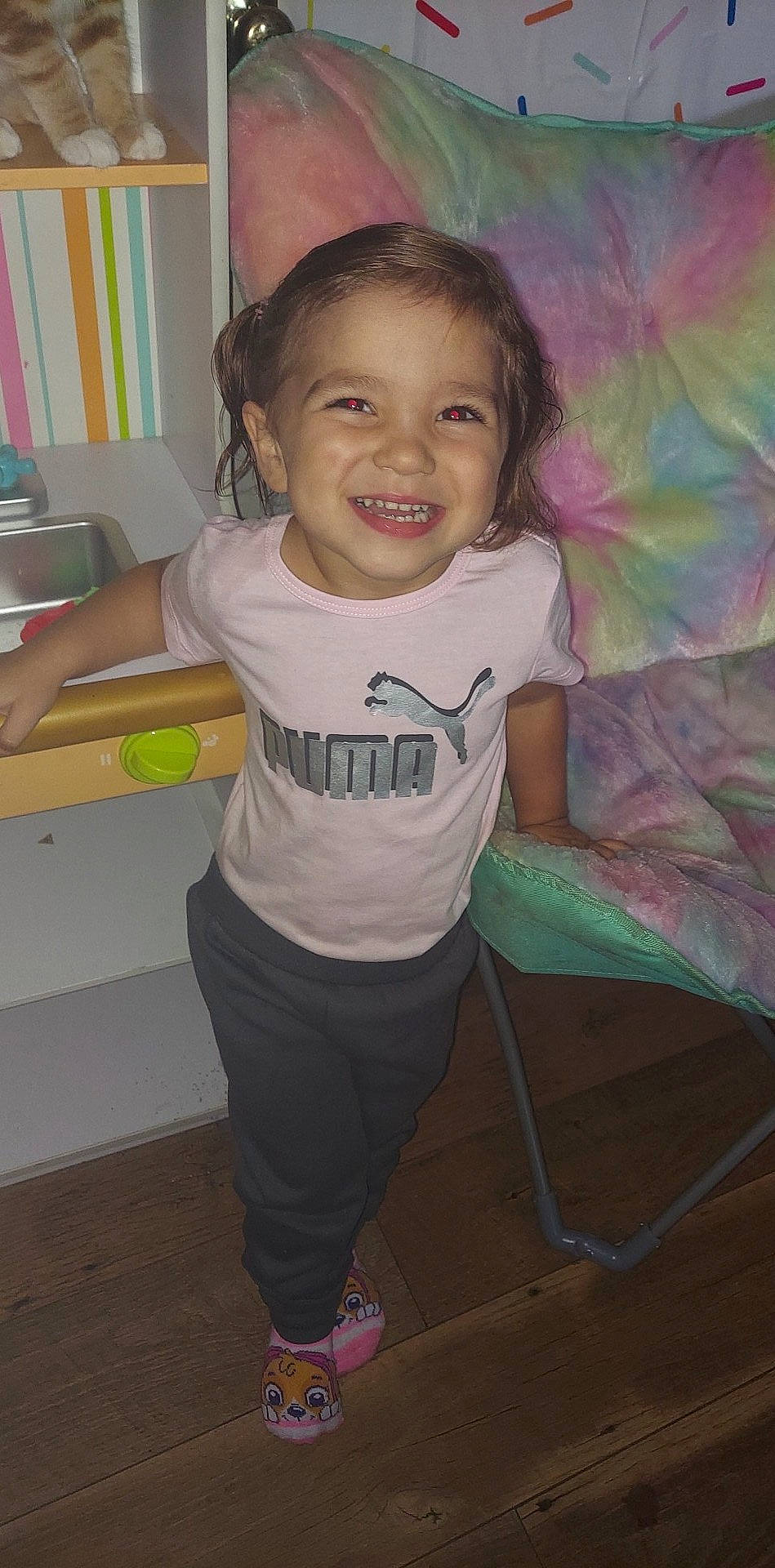 Abigail Violet is registered to the contest to win money with this photo: arm, cheek, child, drawer, face, flash_photography, fun, hair, hairstyle, happy, iris, joy, magenta, person, pink, room, sitting, sleeve, smile, standing