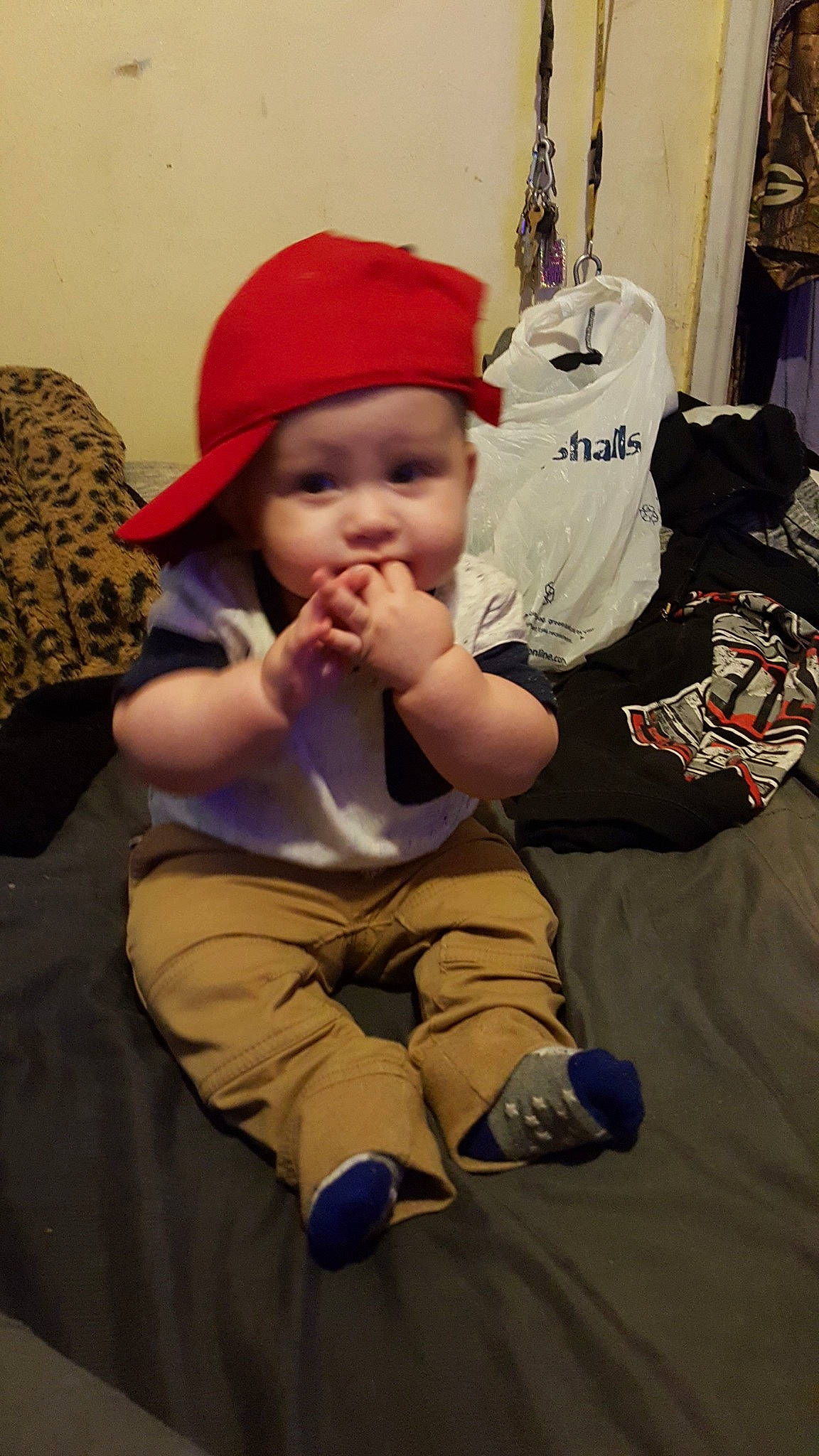 Luciano is registered to the contest to win money with this photo: baby, child, headgear, headwear, person, sitting, toddler