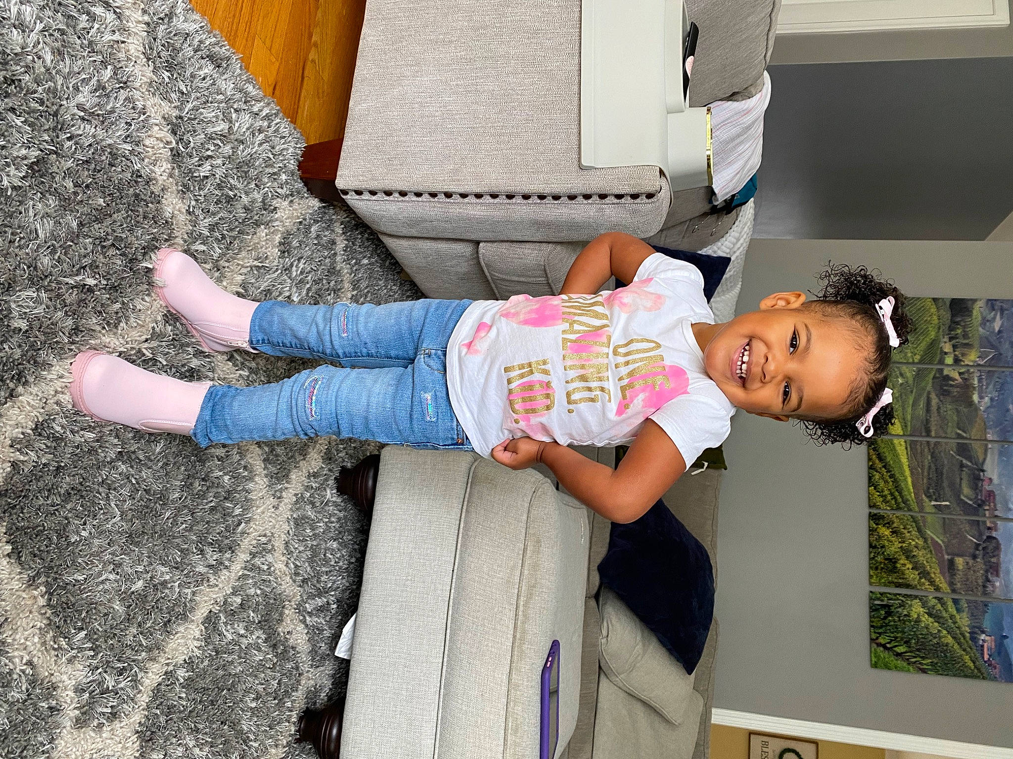 Xolani joined the competition — help win amazing prizes! baby, baby_toddler_clothing, child, comfort, denim, flooring, foot, fun, human_leg, joy, leisure, pattern, person, sitting, sleeve, sock, t_shirt, toddler, travel, vacation