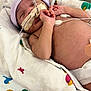 newborn, baby, medical_tube, hospital, blanket, monitor, infant, sleeping, bed, healthcare, person, skin, hand, headwear, cute, child, resting, pediatric, patient, care