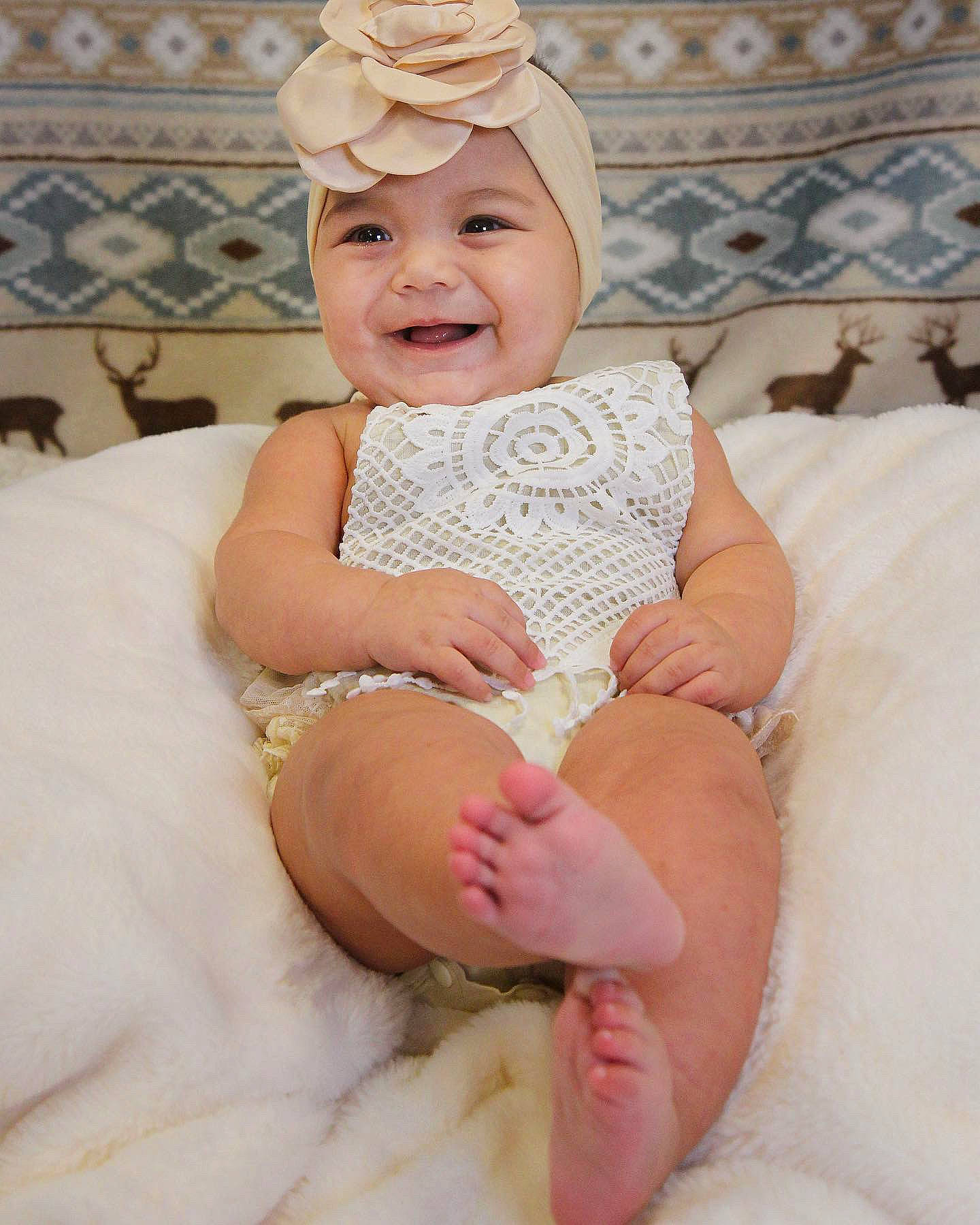 Olive joined the competition — help win amazing prizes! baby, baby_toddler_clothing, child, comfort, event, eye, face, facial_expression, finger, happy, head, headgear, headpiece, headwear, joy, person, pink, skin, sleeve, smile