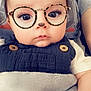 Aiden is registered to the contest to win money with this photo: baby, child, face, glasses, filter, bear_ears, blanket, clothing, cute, infant, portrait, person, indoor, soft_texture, button, eyewear, young_child, sitting, closeup, expression