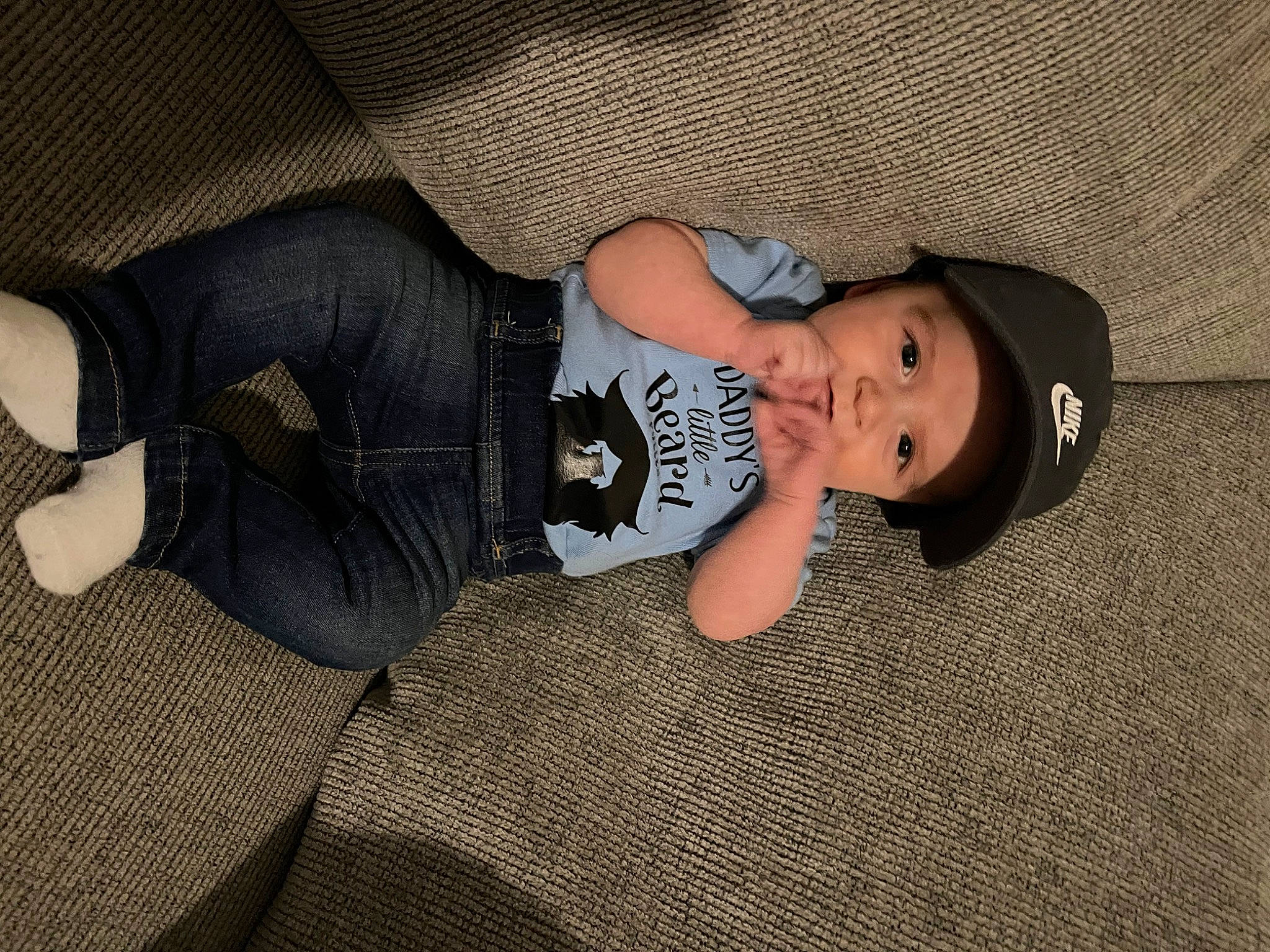 Kaison is registered to the contest to win money with this photo: baby, baby_products, baby_toddler_clothing, child, comfort, flooring, fun, hat, head, headwear, human_leg, knee, mammal, pattern, person, sitting, sleeve, textile, thigh, toddler