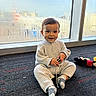 Jacob joined the competition — help win amazing prizes! toddler, child, toy_car, plush_toy, mickey_mouse, carpet, window, condensation, indoor, natural_light, smiling, cozy_clothing, socks, floor, playtime, cute, happy, young_child, casual, portrait