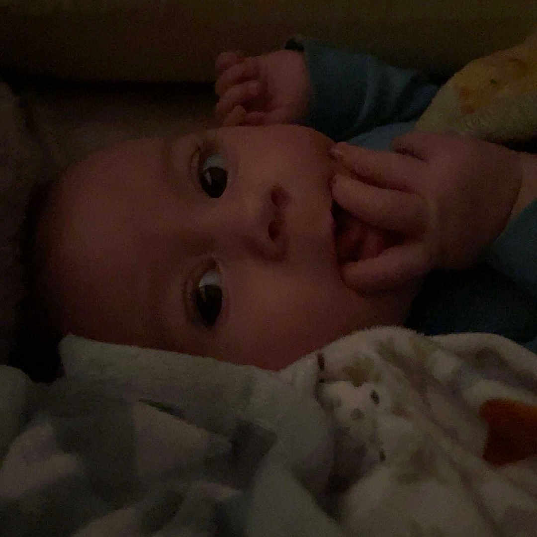 Nolan joined the competition — help win amazing prizes! baby, blanket, child, closeup, cozy, cute, expression, eyes, face, hand, indoor, infant, newborn, portrait, resting, skin, sleepwear, soft, warm, young