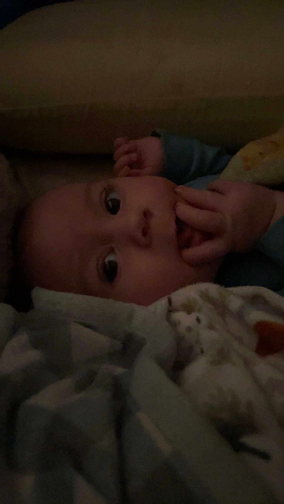 Nolan joined the competition — help win amazing prizes! baby, infant, blanket, hand, face, eyes, sleepwear, cozy, indoor, cute, child, portrait, newborn, soft, warm, resting, closeup, expression, skin, young