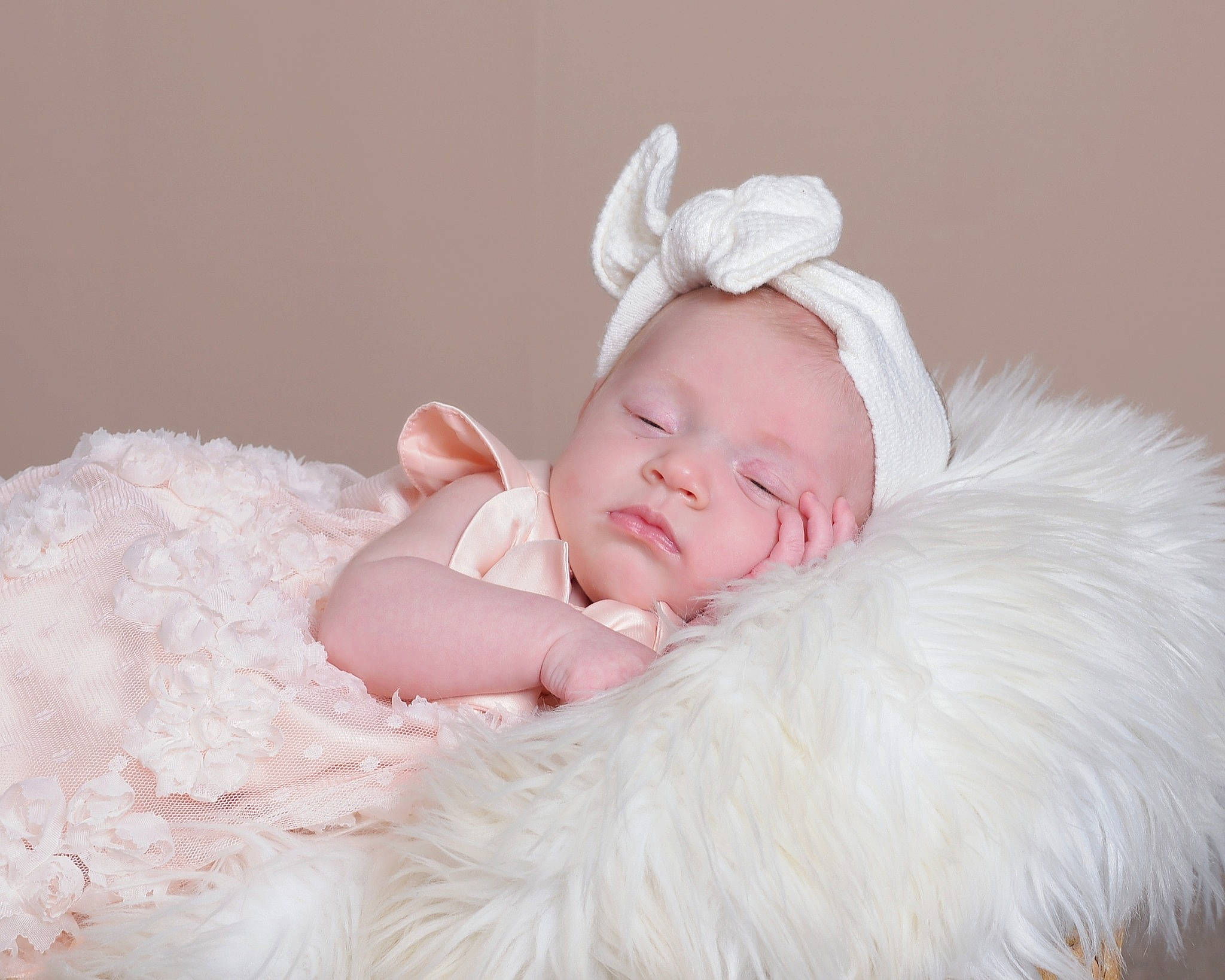 Estella is registered to the contest to win money with this photo: baby, baby_toddler_clothing, child, comfort, embellishment, fashion_accessory, flash_photography, fur, hair_accessory, happy, headband, headpiece, linens, peach, person, petal, pink, portrait_photography, sitting, sleeve