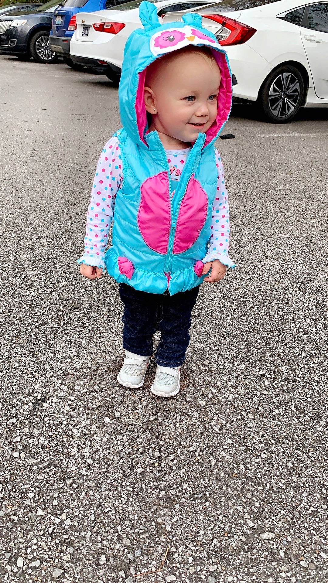 Hazel is registered to the contest to win money with this photo: alloywheel, baby, car, carwheel, clothing, coat, face, head, hood, jacket, machine, pants, person, photography, portrait, spoke, tire, transportation, vehicle, wheel