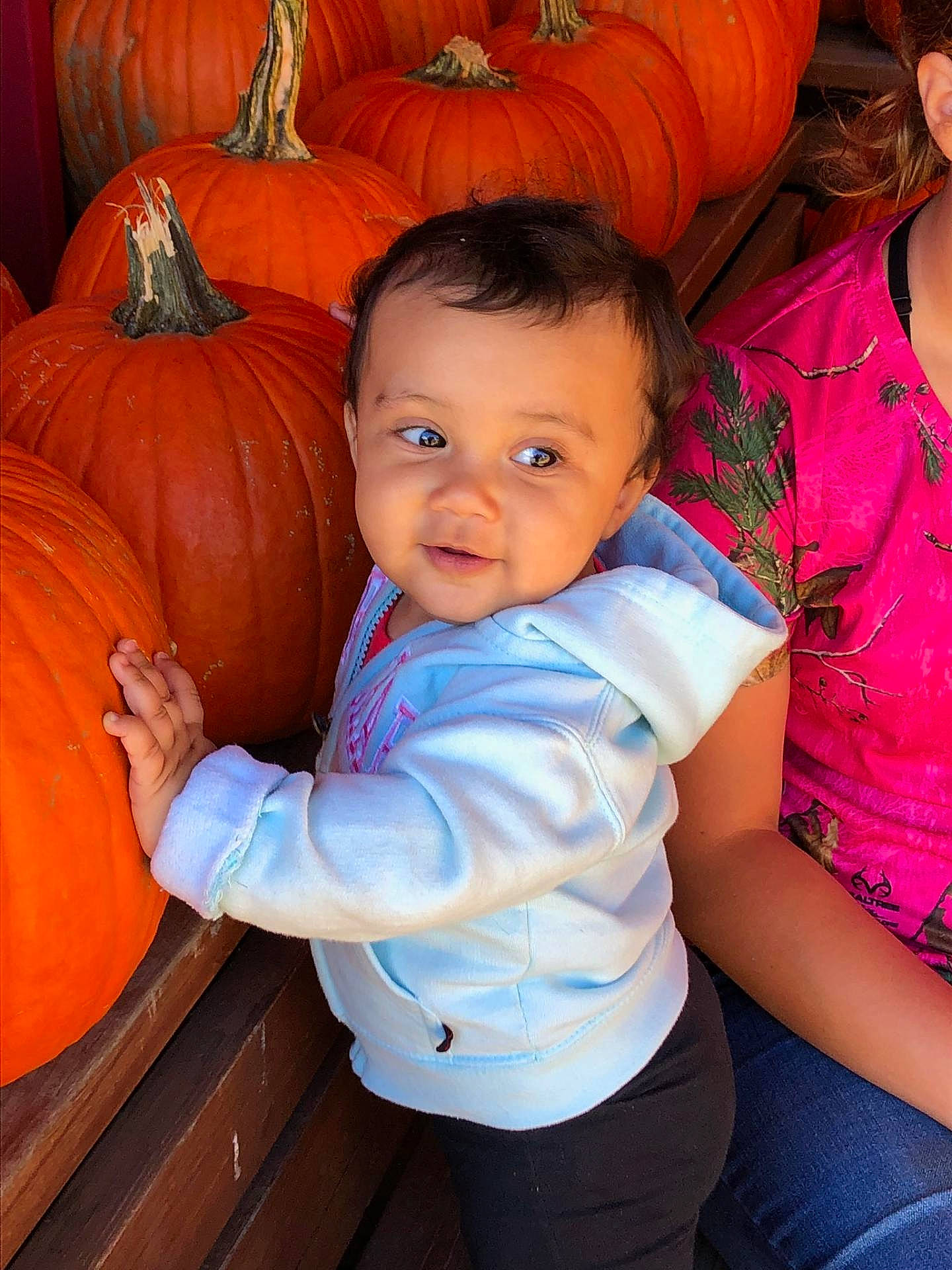 Rayna is registered to the contest to win money with this photo: abdomen, calabaza, child, eye, fun, girl, happiness, infant, person, pumpkin, sitting, skin, smile, toddler, winter_squash