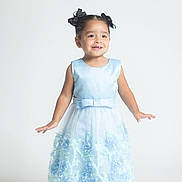 Nevaeh joined the competition — help win amazing prizes! child, girl, dress, blue_dress, smiling, standing, hair_bows, happy, portrait, studio, cute, fashion, shoes, floor, white_background, young, innocent, childhood, formal_wear, pretty
