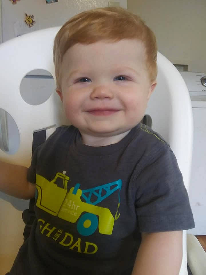 Gordon is registered to the contest to win money with this photo: arm, baby, cheek, child, ear, eye, face, finger, forehead, head, joy, neck, person, play, product, room, skin, smile, t_shirt, toddler