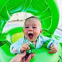 baby, child, floatie, green, frog, toy, water, pool, happy, laughing, hand, tattoo, sleeves, blue_eyes, outdoor, summer, fun, playful, cute, inflatable