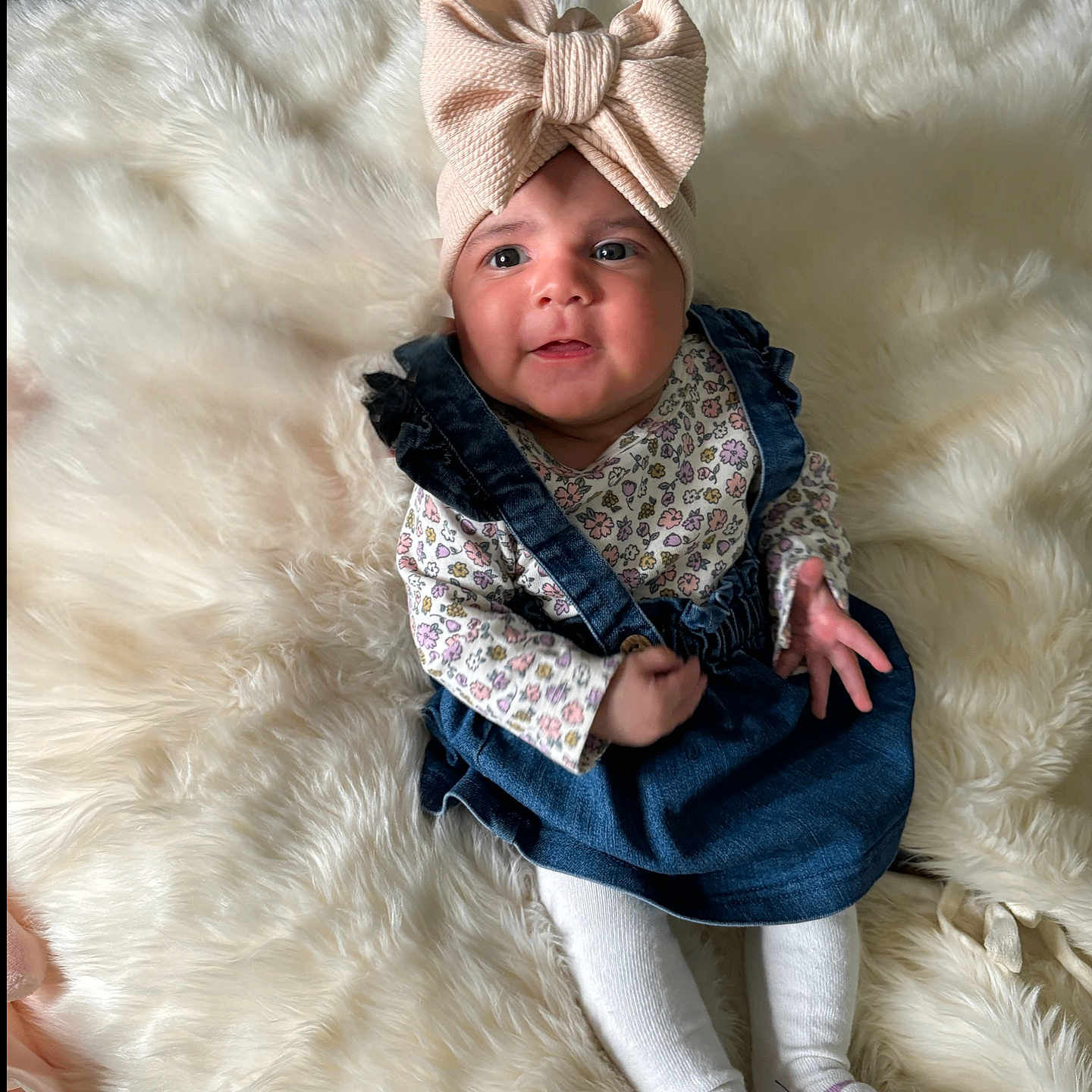 Daniela is registered to the contest to win money with this photo: animal, baby, bodypart, bonnet, canine, cap, clothing, couch, face, finger, furniture, hand, hat, head, hosiery, pants, person, photography, portrait, sock