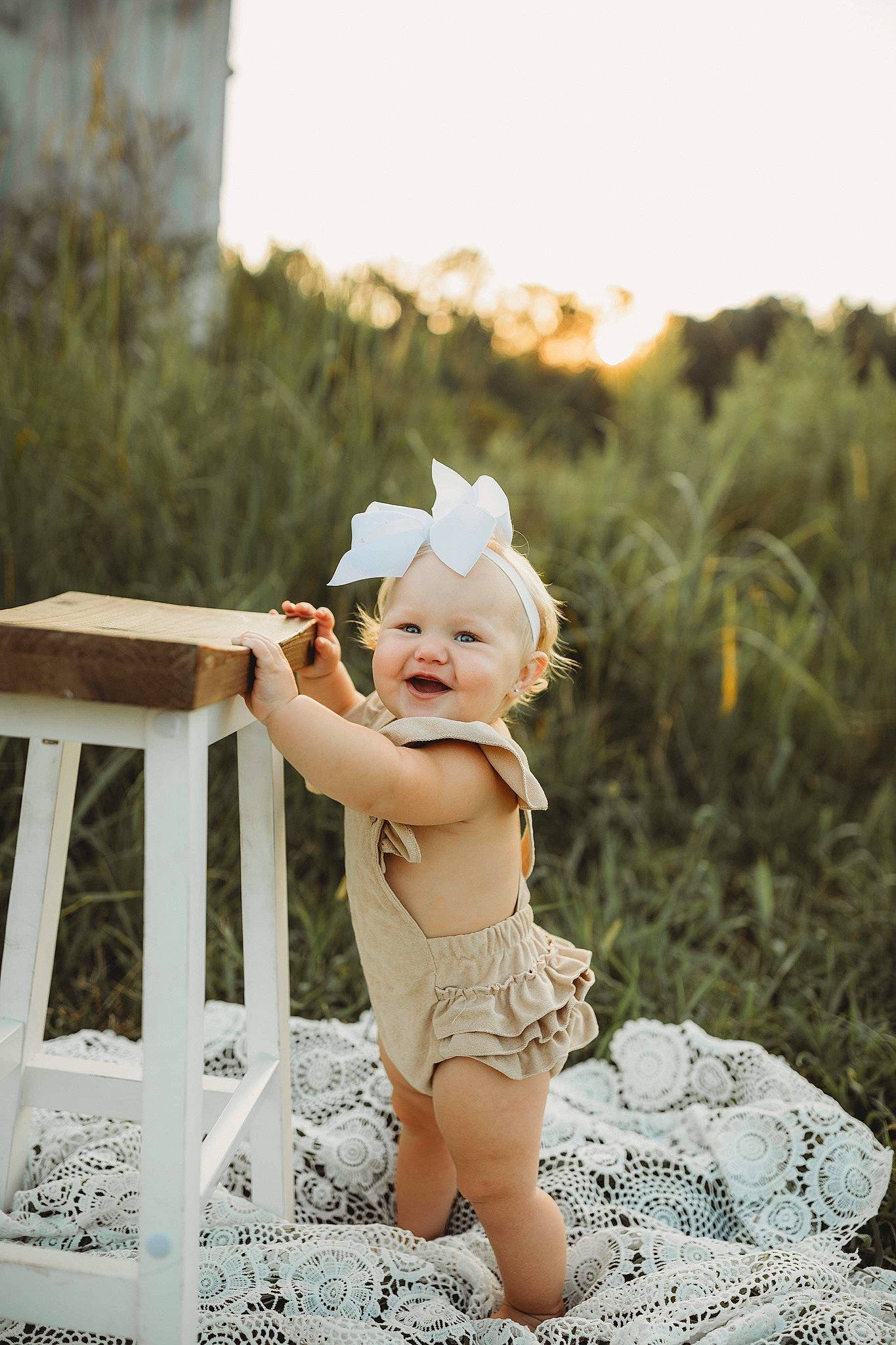 Blakely is registered to the contest to win money with this photo: baby, baby_toddler_clothing, child, fashion_accessory, flash_photography, fun, grass, happy, hat, headband, headpiece, people_in_nature, person, personal_protective_equipment, plant, portrait_photography, sitting, sky, sun_hat, toddler