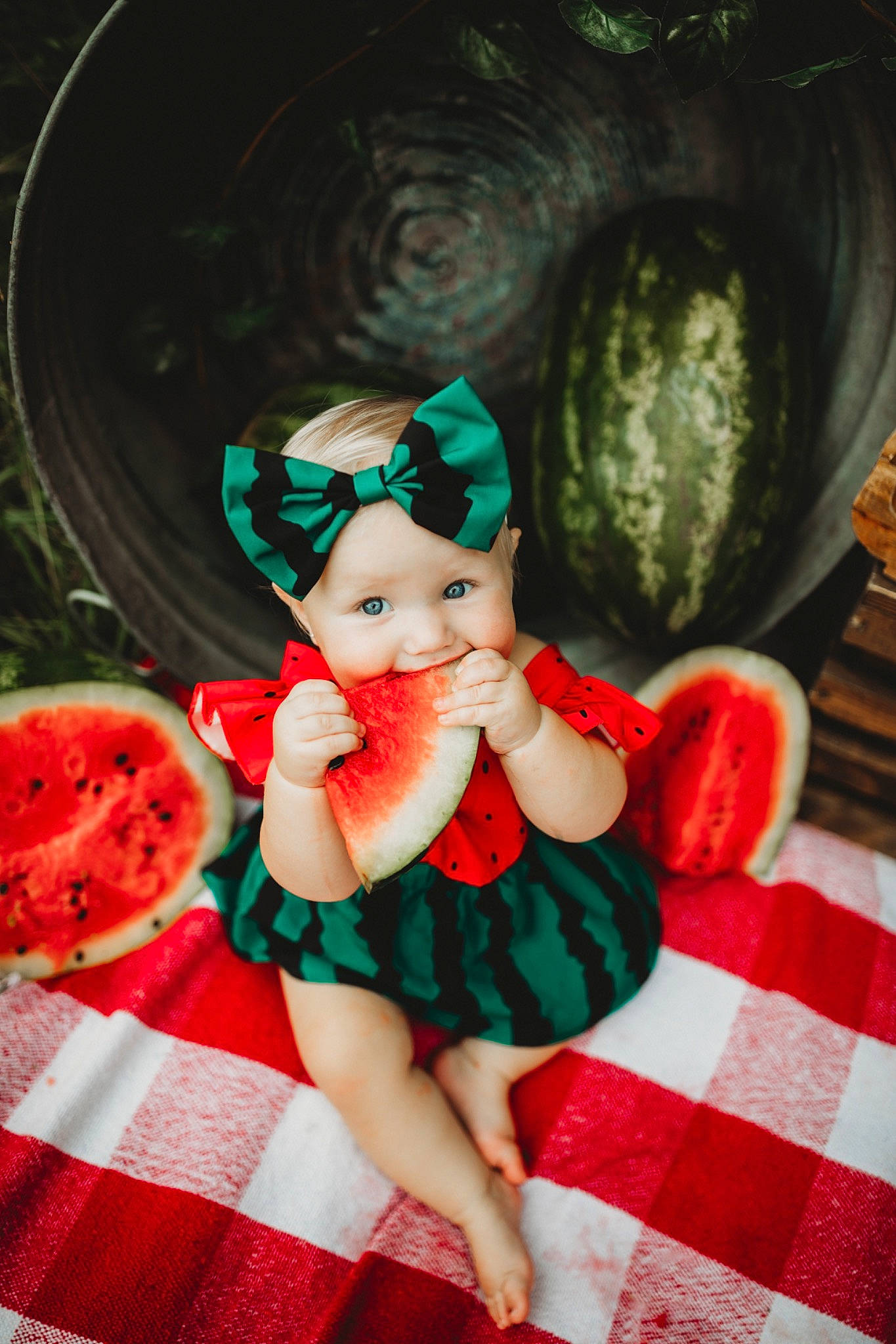 Blakely is registered to the contest to win money with this photo: baby_toddler_clothing, child, christmas_decoration, christmas_ornament, doll, dress, event, grass, happy, hat, headwear, holiday, pattern, person, petal, pink, plaid, plant, recreation, tartan