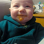Tristan joined the competition — help win amazing prizes! baby, child, messy_face, smiling, hoodie, food, baby_food, high_chair, indoor, closeup, happy, face, clothing, seatbelt, feeding, infant, cute, portrait, chubby_cheeks, dining